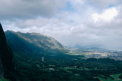 Scenic view of mountains against cloudy sky