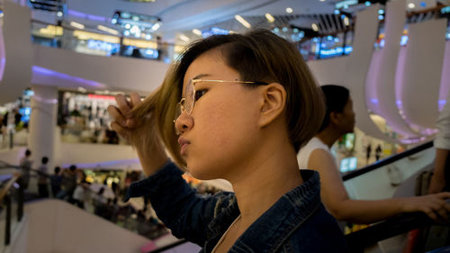 Close-up of young woman in mall