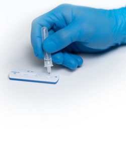 Close-up of human hand against white background