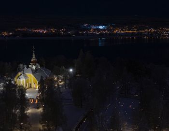 Illuminated buildings in city at night