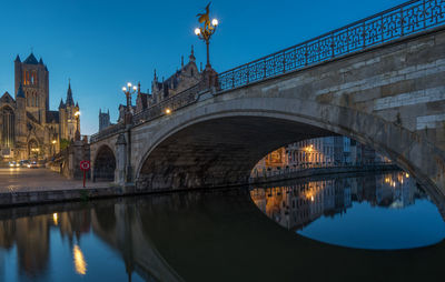 St michaels bridge and st bavos cathedral at night