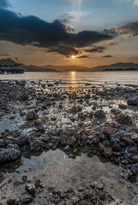 Scenic view of sea against sky during sunset