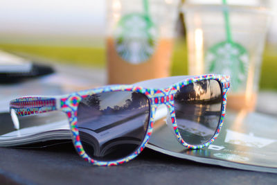 Close-up of sunglasses on table