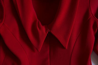 Close up of back neckline of a vintage red dress ii crepe fabric of wool