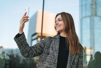 Young woman using mobile phone