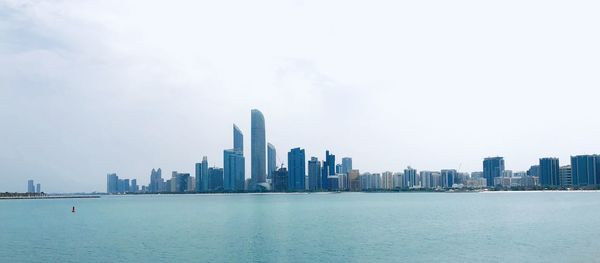 Sea with buildings in background