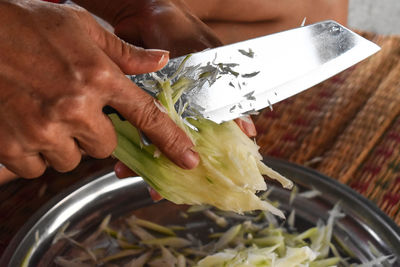 Close-up of man preparing food