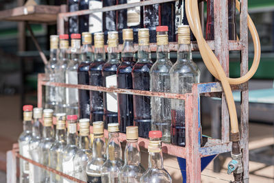 Bottles on display at market stall