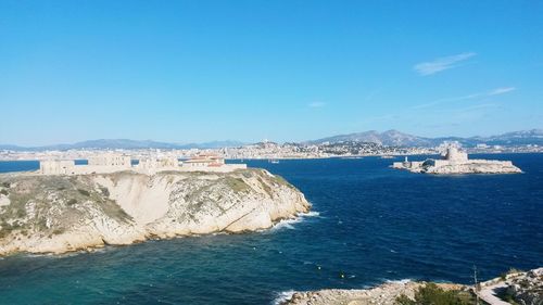 Scenic view of sea against blue sky