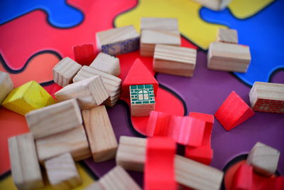 High angle view of toy blocks on multi colored table