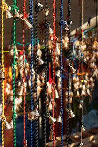 Metallic bells hanging at market stall