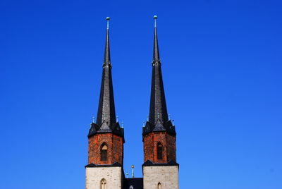 Low angle view of building against clear blue sky