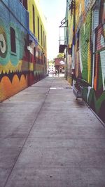 Alley amidst buildings in city