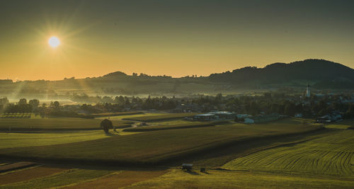 Scenic view of landscape against sky during sunset