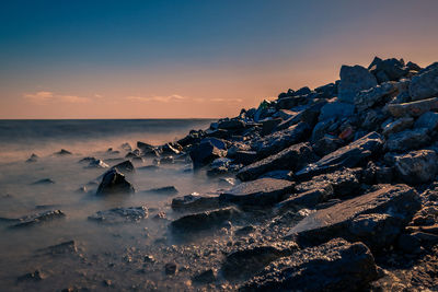 Scenic view of sea against sky during sunset