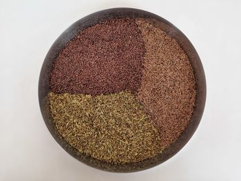 Directly above shot of bread in bowl against white background