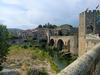 Beautiful side view off a city in spain with bridge and tower