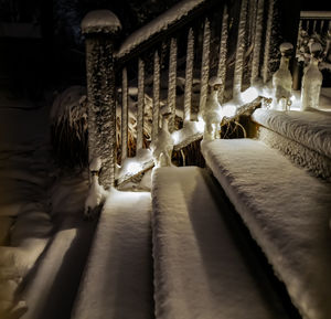 Fresh snow on the back steps at night