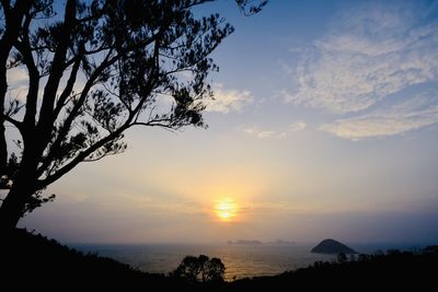 Scenic view of silhouette landscape against sky at sunset