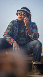 Portrait of young man sitting on boat