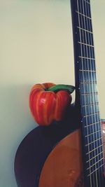 Close-up of guitar on table