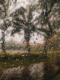 Full frame shot of wet glass window in rainy season