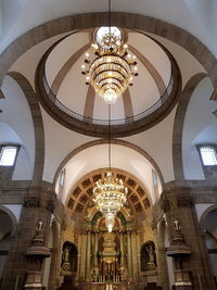 Low angle view of illuminated ceiling