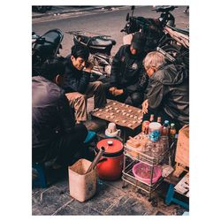 People at market stall