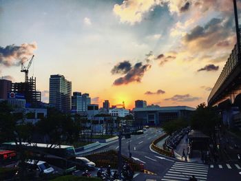 View of city street at sunset