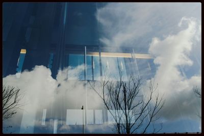 Low angle view of building against cloudy sky