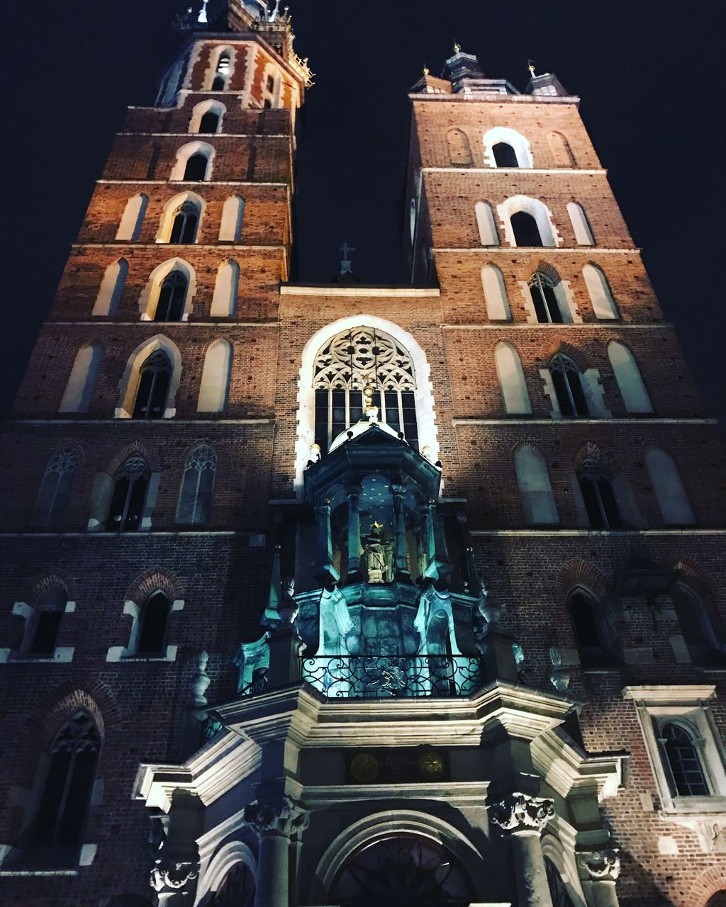 place of worship, religion, spirituality, low angle view, architecture, history, built structure, building exterior, statue, travel destinations, no people, sculpture, outdoors, day, sky