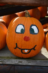 Close-up of pumpkin on wood during halloween