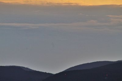 Scenic view of silhouette mountain against sky during sunset