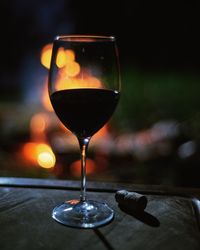 Close-up of wineglass on table
