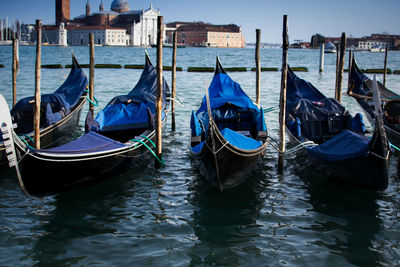 Boats moored in canal