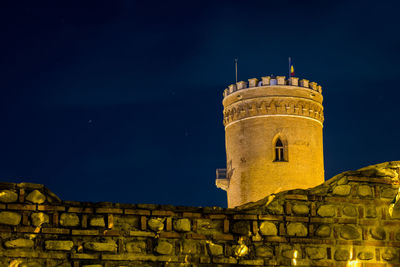 Low angle view of old building against sky at night