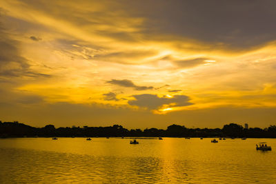 Scenic view of sea against orange sky