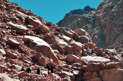 Rocks on mountain against clear sky