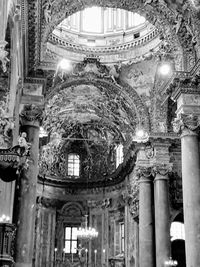 Low angle view of illuminated chandelier in building