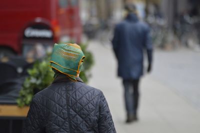 Rear view of man walking on street