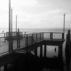 Pier on sea against sky