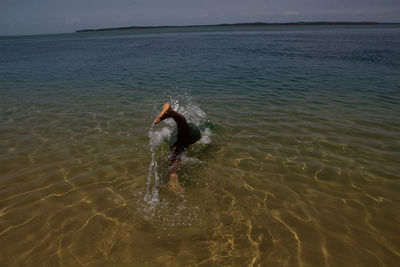 Man swimming in sea