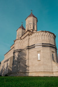 Low angle view of building against blue sky