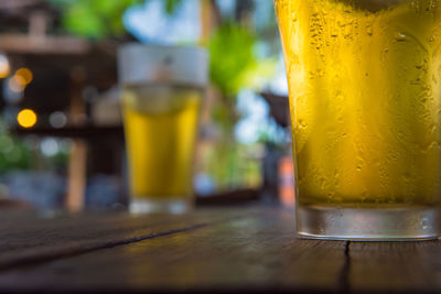 Close-up of beer glass on table