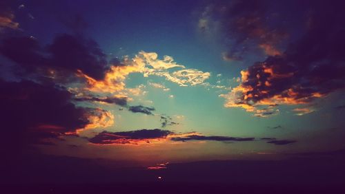 Low angle view of dramatic sky during sunset