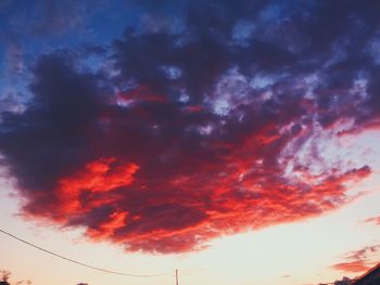 Low angle view of dramatic sky during sunset