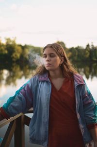 Portrait of a young woman looking away