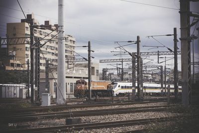 Train on railroad track against sky