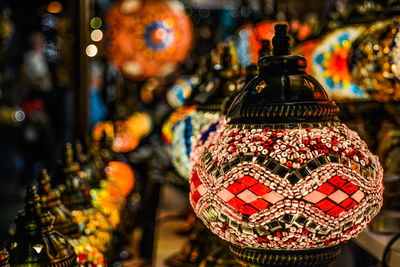 Close-up of decorations hanging in store for sale