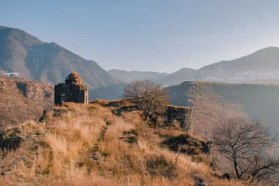 Built structure on land against sky